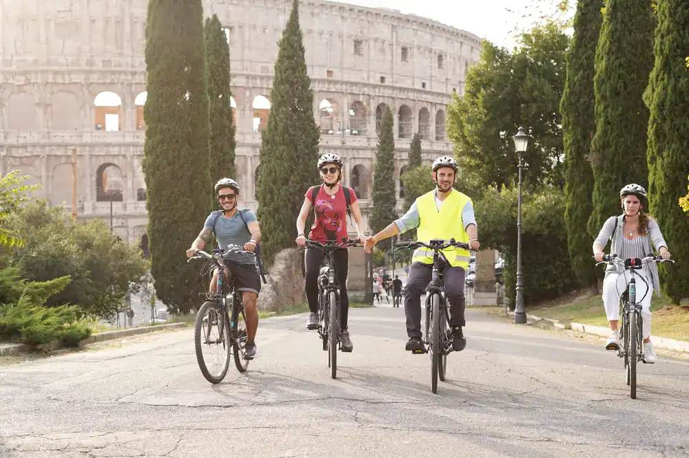 A small group of cyclists led by a guide